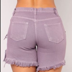 Fashion Nova distressed Bermuda shorts.